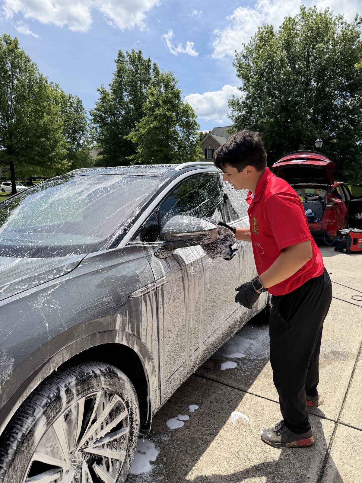 Foam wash on Volkswagen ID.4 hood, mid-pass