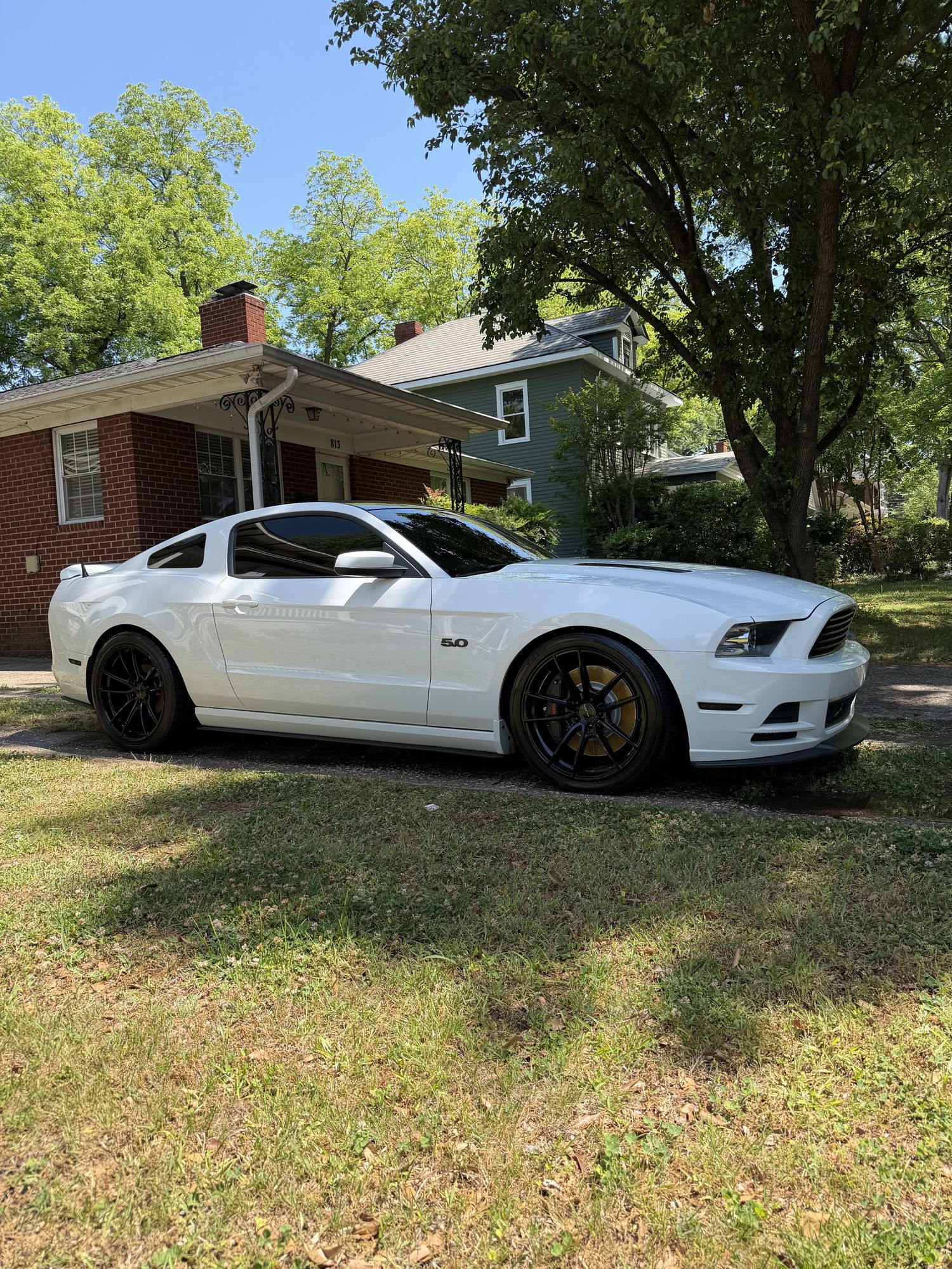 White Ford Mustang GT 5.0 in Plaza Midwood after correction and coating