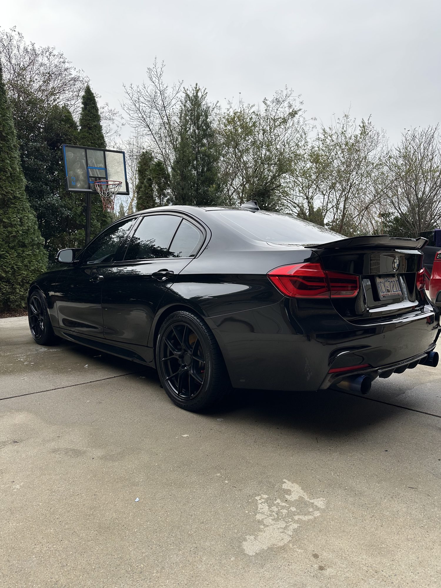 2018 BMW 340i M Sport in black, rear three-quarter view after correction and ceramic, Lake Norman