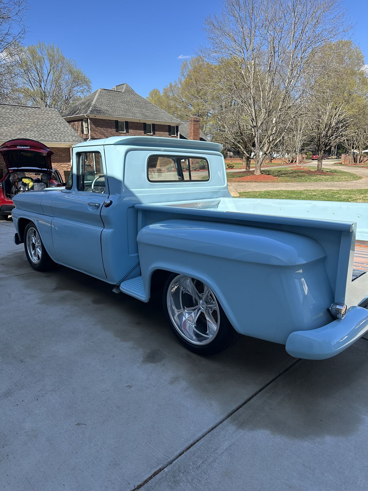 1965 Chevrolet C10 rear three-quarter showing chrome trim
